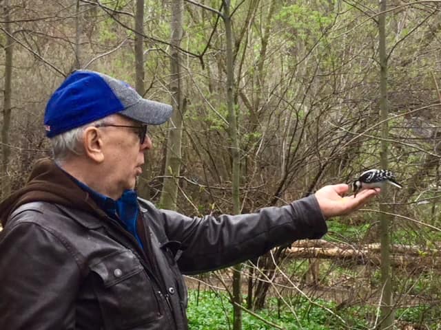 Fred birdfeeding in North Woods of Central Park